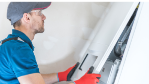 Technician performing heating repair on a gas furnace in a Bella Vista, AR home